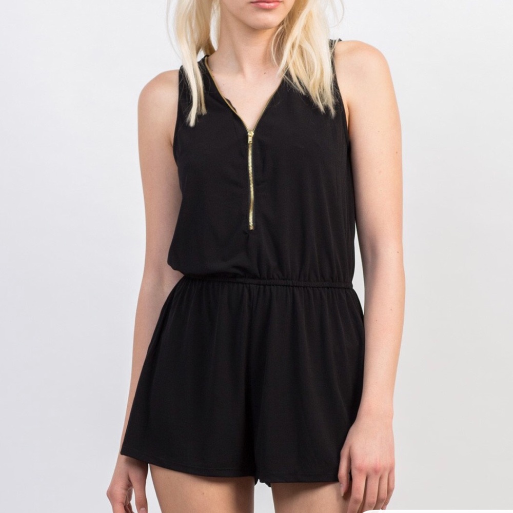 Black romper with gold zipper